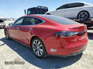 2014 Tesla Model S 60 with VIN 5YJSA1H17EFP64266, listed as a Copart auction lot 61678485 with 104,160 mi miles and Salvage title. Bid and sale history available at DreamBid. Image 2.