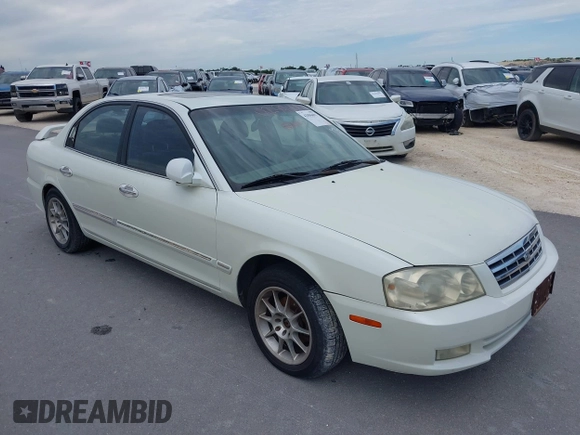 2002 Kia Optima LX z VIN KNAGD126325144218, wystawiony jako IAAI lot #42596691 z przebiegiem 220 972 mil mil oraz . Historia ofert i sprzedaży dostępna na DreamBid. Obrazek 1.