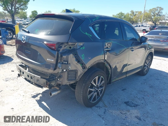 2018 Mazda CX-5 Grand Touring with VIN JM3KFBDM8J0314925, listed as a IAAI auction lot 41825917 with 70,027 mi miles. Bid and sale history available at carsss.com. Image 4.