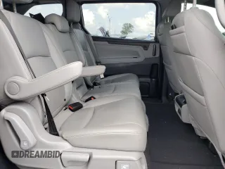 2021 Honda Odyssey Touring z VIN 5FNRL6H85MB039444, wystawiony jako Copart lot #57142205 z przebiegiem 74 228 mil mil oraz Szkoda całkowita • Salvage title. Historia ofert i sprzedaży dostępna na DreamBid. Obrazek 11.