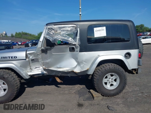 2005 Jeep Wrangler Unlimited with VIN 1J4FA44S55P352803, listed as a IAAI auction lot 42688284 with 128,586 mi miles and . Bid and sale history available at DreamBid. Image 14.
