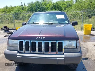 1997 Jeep Grand Cherokee TSi with VIN 1J4FX58S2VC747897, listed as a IAAI auction lot 42033868 with 119,924 mi miles. Bid and sale history available at carsss.com. Image 12.