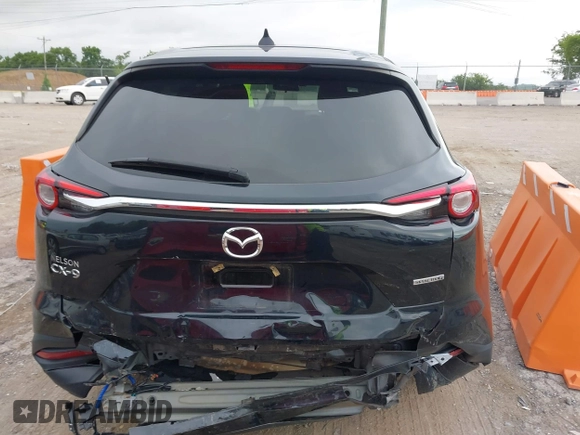 2021 Mazda CX-9 Sport with VIN JM3TCABY6M0522352, listed as a IAAI auction lot 42613136 with 106,167 mi miles and . Bid and sale history available at DreamBid. Image 16.