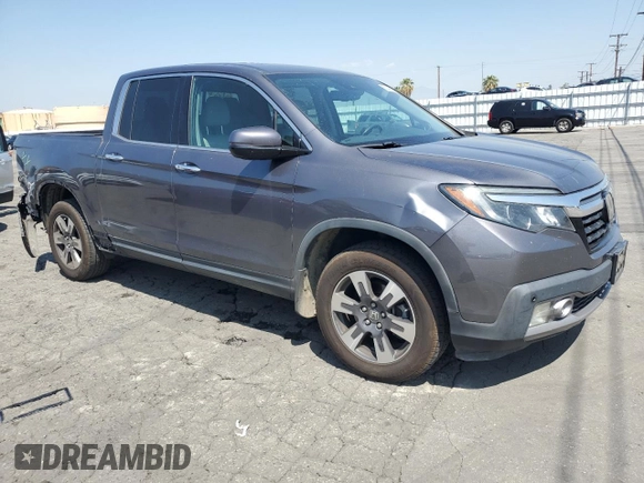 2019 Honda Ridgeline RTL-E with VIN 5FPYK3F73KB016675, listed as a Copart auction lot 55340905 with 69,571 mi miles and Salvage title. Bid and sale history available at DreamBid. Image 4.