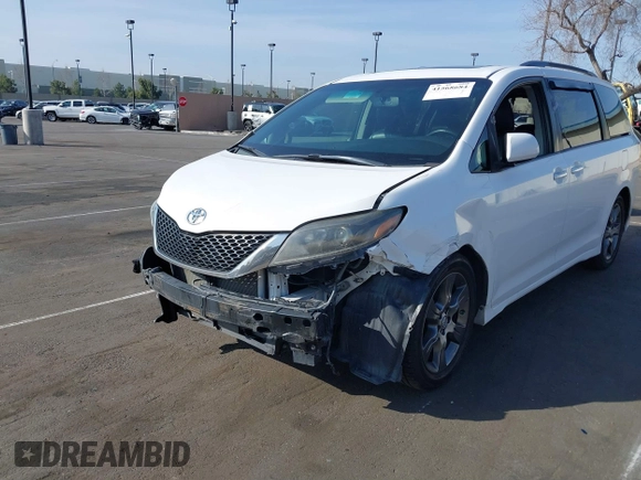 2015 Toyota Sienna SE with VIN 5TDXK3DC6FS627578, listed as a IAAI auction lot 41568684 with 124,138 mi miles and . Bid and sale history available at DreamBid. Image 6.