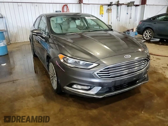 2017 Ford Fusion Titanium z VIN 3FA6P0D93HR303905, wystawiony jako Copart lot #63621745 z przebiegiem 120 249 mil mil oraz Szkoda całkowita • Salvage title. Historia ofert i sprzedaży dostępna na DreamBid. Obrazek 13.