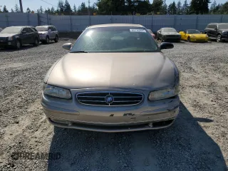 1999 Buick Regal LS with VIN 2G4WB52K8X1624610, listed as a Copart auction lot 64716284 with 106,902 mi miles and Salvage Title. Bid and sale history available at carsss.com. Image 5.
