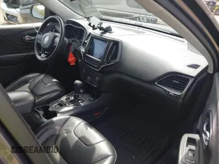 2019 Jeep Cherokee Trailhawk with VIN 1C4PJMBX2KD231734, listed as a IAAI auction lot 42235469 with 104,565 mi miles and . Bid and sale history available at DreamBid. Image 5.