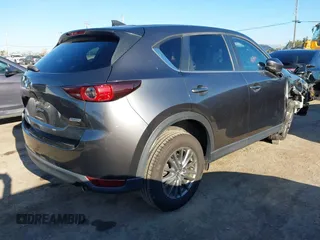 2017 Mazda CX-5 Touring with VIN JM3KFBCL2H0165625, listed as a IAAI auction lot 41879145 with 64,745 mi miles. Bid and sale history available at carsss.com. Image 4.