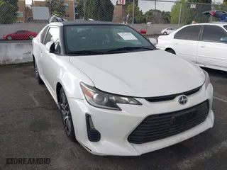 2016 Scion tC with VIN JTKJF5C75GJ014448, listed as a IAAI auction lot 41755541 with 60,571 mi miles. Bid and sale history available at carsss.com. Image 1.
