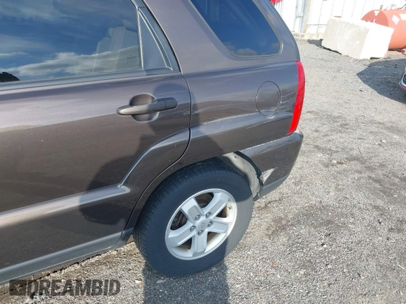 2009 Kia Sportage LX with VIN KNDJE723097623239, listed as a IAAI auction lot 41233933 with 169,444 mi miles. Bid and sale history available at carsss.com. Image 6.