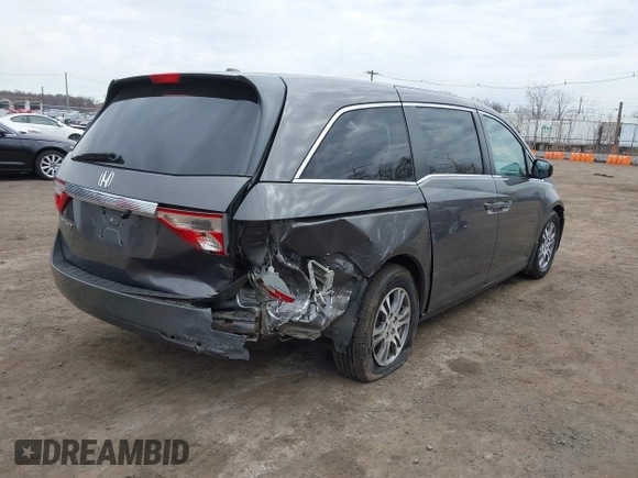 2012 Honda Odyssey EX-L with VIN 5FNRL5H65CB042898, listed as a IAAI auction lot 41784075 with 179,596 mi miles and . Bid and sale history available at carsss.com. Image 4.