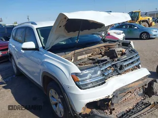 2018 Volkswagen Atlas SE with VIN 1V2CR2CA2JC579073, listed as a IAAI auction lot 41968461 with 118,656 mi miles and . Bid and sale history available at DreamBid. Image 1.