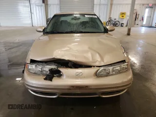 2002 Oldsmobile Alero GL1 z VIN 1G3NL52F52C133589, wystawiony jako Copart lot #77093824 z przebiegiem 150 353 mil mil oraz Szkoda całkowita • Salvage title. Historia ofert i sprzedaży dostępna na DreamBid. Obrazek 5.