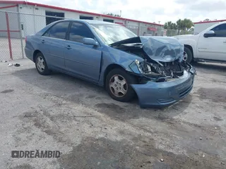 2002 Toyota Camry XLE z VIN 4T1BF32K72U537656, wystawiony jako IAAI lot #42113475 z przebiegiem 208 769 mil mil oraz . Historia ofert i sprzedaży dostępna na DreamBid. Obrazek 1.
