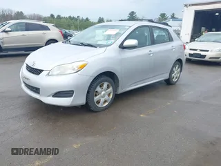 2009 Toyota Matrix with VIN 2T1KU40E99C006768, listed as a IAAI auction lot 42125813 with 163,832 mi miles. Bid and sale history available at carsss.com. Image 2.