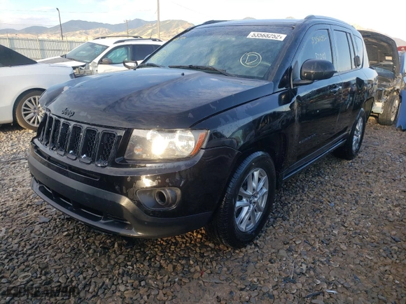 2014 Jeep Compass Sport with VIN 1C4NJCBA5ED651747, listed as a Copart auction lot 48759744 with 82,248 mi miles and Salvage Title. Bid and sale history available at carsss.com. Image 2.