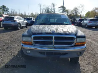 1999 Dodge Dakota SLT with VIN 1B7GG22X8XS115282, listed as a IAAI auction lot 42136576 with 220,465 mi miles and . Bid and sale history available at carsss.com. Image 12.