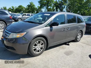 2013 Honda Odyssey EX-L with VIN 5FNRL5H64DB005729, listed as a Copart auction lot 63014525 with 222,567 mi miles and Salvage title. Bid and sale history available at DreamBid. Image 1.