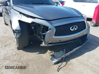 2014 Infiniti Q50 Premium with VIN JN1BV7AP5EM672766, listed as a IAAI auction lot 42107952 with 66,929 mi miles. Bid and sale history available at carsss.com. Image 6.