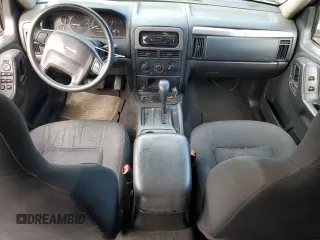 2004 Jeep Grand Cherokee Laredo with VIN 1J4GX48S24C216941, listed as a Copart auction lot 55584785 with 279,710 mi miles and Salvage title. Bid and sale history available at DreamBid. Image 8.