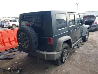 2010 Jeep Wrangler Unlimited Sport with VIN 1J4BA3H13AL125010, listed as a IAAI auction lot 41734482 with 183,773 mi miles. Bid and sale history available at carsss.com. Image 4.