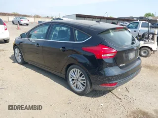 2017 Ford Focus Titanium with VIN 1FADP3N29HL319759, listed as a IAAI auction lot 42458289 with 213,674 mi miles and . Bid and sale history available at DreamBid. Image 3.
