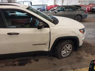 2018 Jeep Compass Sport with VIN 3C4NJCAB6JT124198, listed as a IAAI auction lot 41192196 with 104,557 mi miles. Bid and sale history available at carsss.com. Image 18.