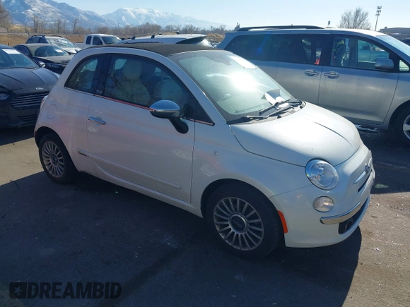 2012 FIAT 500 Lounge z VIN 3C3CFFER7CT119147, wystawiony jako IAAI lot #41431509 z przebiegiem 140 084 mil mil oraz . Historia ofert i sprzedaży dostępna na DreamBid. Obrazek 1.