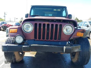 2003 Jeep Wrangler Sport with VIN 1J4FA49S33P345192, listed as a IAAI auction lot 41801344 with 196,472 mi miles. Bid and sale history available at carsss.com. Image 12.