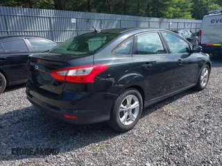 2013 Ford Focus SE with VIN 1FADP3F21DL180199, listed as a IAAI auction lot 42768802 with 125,095 mi miles and . Bid and sale history available at DreamBid. Image 4.