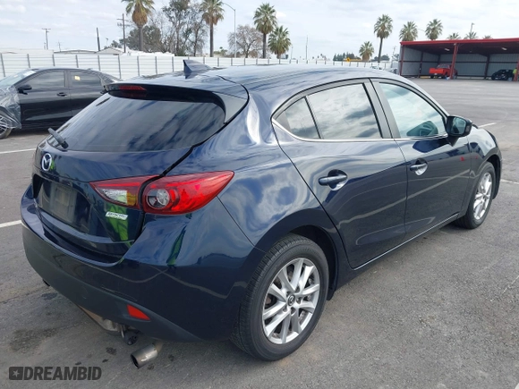 2016 Mazda Mazda3 i Grand Touring with VIN JM1BM1N74G1319656, listed as a IAAI auction lot 41561603 with 123,610 mi miles. Bid and sale history available at carsss.com. Image 4.