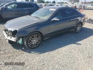 2009 Mercedes-Benz CLK 350 with VIN WDBTJ56H99F261060, listed as a Copart auction lot 69812004 with 105,218 mi miles and Salvage Title. Bid and sale history available at carsss.com. Image 1.