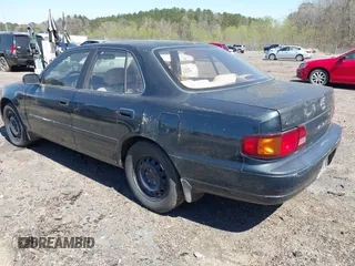1995 Toyota Camry LE with VIN 4T1GK12E5SU860216, listed as a IAAI auction lot 41803933 with 235,130 mi miles. Bid and sale history available at carsss.com. Image 3.