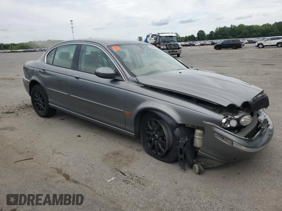 2003 Jaguar X-Type z VIN SAJEB52D33XD54978, wystawiony jako Copart lot #58027805 z przebiegiem Nie podano mil oraz Szkoda całkowita • Salvage title. Historia ofert i sprzedaży dostępna na DreamBid. Obrazek 4.
