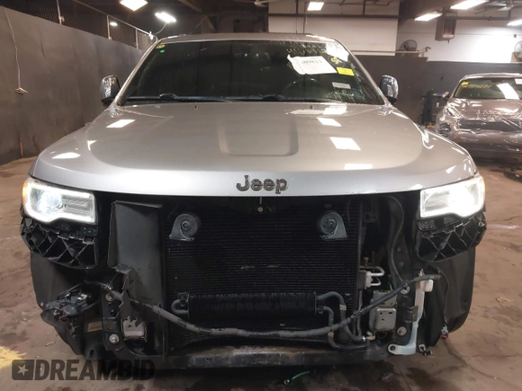 2015 Jeep Grand Cherokee Overland with VIN 1C4RJFCG1FC215426, listed as a IAAI auction lot 41689821 with 128,563 mi miles. Bid and sale history available at carsss.com. Image 6.