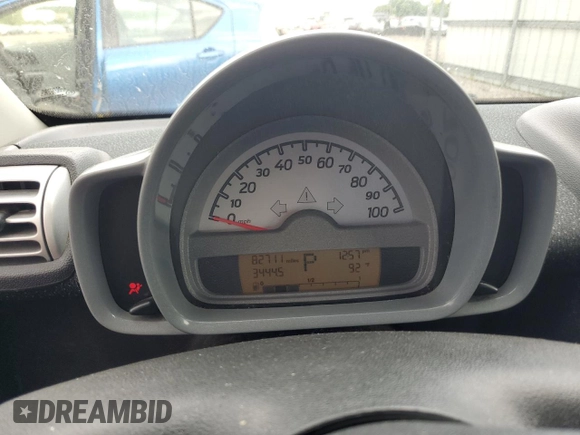 2009 Smart fortwo Pure with VIN WMEEJ31X59K218003, listed as a Copart auction lot 62413775 with 82,711 mi miles and Salvage title. Bid and sale history available at DreamBid. Image 9.