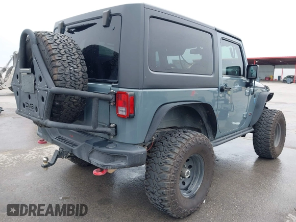 2013 Jeep Wrangler Rubicon 10th Anniversary with VIN 1C4BJWCG2DL651815, listed as a IAAI auction lot 41643919 with 98,297 mi miles and . Bid and sale history available at DreamBid. Image 4.