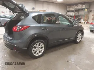 2013 Mazda CX-5 Touring with VIN JM3KE4CE4D0157892, listed as a IAAI auction lot 41684348 with 146,496 mi miles and . Bid and sale history available at DreamBid. Image 4.