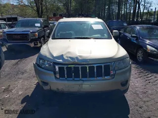 2011 Jeep Grand Cherokee Laredo with VIN 1J4RR4GG8BC590094, listed as a IAAI auction lot 41990149 with 178,510 mi miles. Bid and sale history available at carsss.com. Image 12.