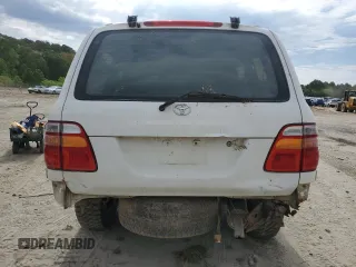 1999 Toyota Land Cruiser z VIN JT3HT05J5X0050404, wystawiony jako Copart lot #56066125 z przebiegiem 385 659 mil mil oraz Tytuł czysty. Historia ofert i sprzedaży dostępna na DreamBid. Obrazek 6.