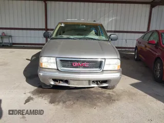 1999 GMC Jimmy SLE with VIN 1GKDT13W7X2529298, listed as a IAAI auction lot 41556249 with 114,750 mi miles. Bid and sale history available at carsss.com. Image 6.