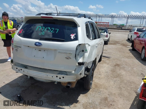 2015 Subaru Forester Touring with VIN JF2SJAWC0FH806493, listed as a IAAI auction lot 42355867 with 128,937 mi miles and . Bid and sale history available at DreamBid. Image 4.