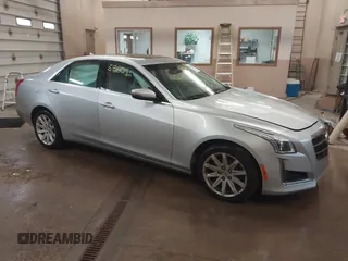 2014 Cadillac CTS Luxury AWD with VIN 1G6AX5S3XE0158960, listed as a IAAI auction lot 41258609 with 84,360 mi miles and . Bid and sale history available at DreamBid. Image 1.