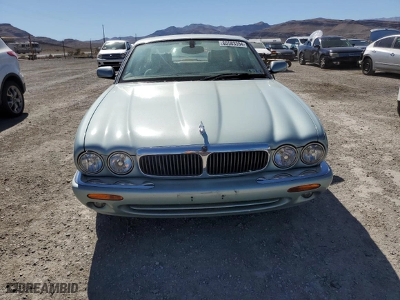 2000 Jaguar XJ with VIN SAJDA14C1YLF10459, listed as a Copart auction lot 65583394 with 113,333 mi miles and Salvage Title. Bid and sale history available at carsss.com. Image 5.