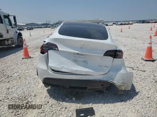 2023 Tesla Model Y Long Range z VIN 7SAYGDEE4PA064502, wystawiony jako Copart lot #53337645 z przebiegiem 16 945 mil mil oraz Szkoda całkowita • Salvage title. Historia ofert i sprzedaży dostępna na DreamBid. Obrazek 6.