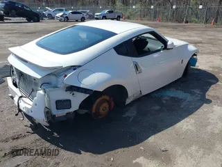 2014 Nissan 370Z with VIN JN1AZ4EH8EM634403, listed as a IAAI auction lot 41923568 with 137,676 mi miles. Bid and sale history available at carsss.com. Image 4.