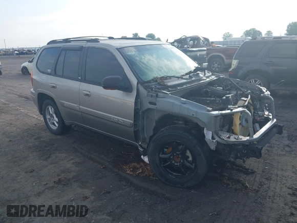 2002 GMC Envoy SLE z VIN 1GKDS13S122357410, wystawiony jako IAAI lot #42355556 z przebiegiem Nie podano mil oraz . Historia ofert i sprzedaży dostępna na DreamBid. Obrazek 1.