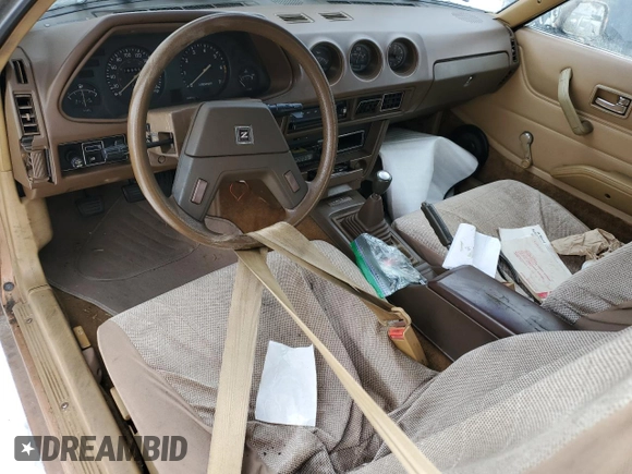 1979 Datsun 280ZX z VIN HS130137808, wystawiony jako Copart lot #43799165 z przebiegiem 28 995 mil mil oraz Tytuł czysty. Historia ofert i sprzedaży dostępna na DreamBid. Obrazek 8.