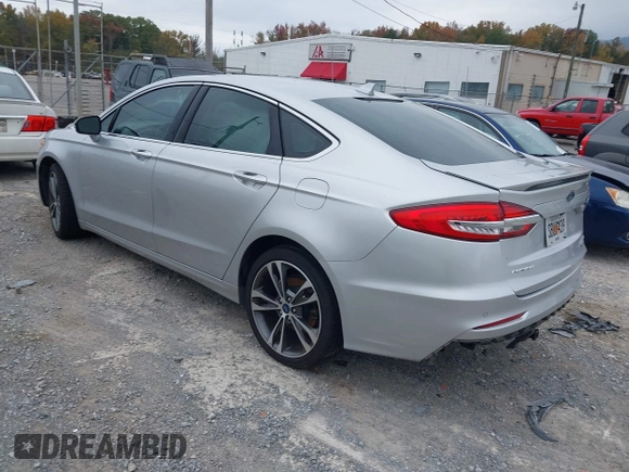 2019 Ford Fusion Titanium with VIN 3FA6P0K96KR120749, listed as a IAAI auction lot 40737085 with 118,376 mi miles and . Bid and sale history available at DreamBid. Image 3.